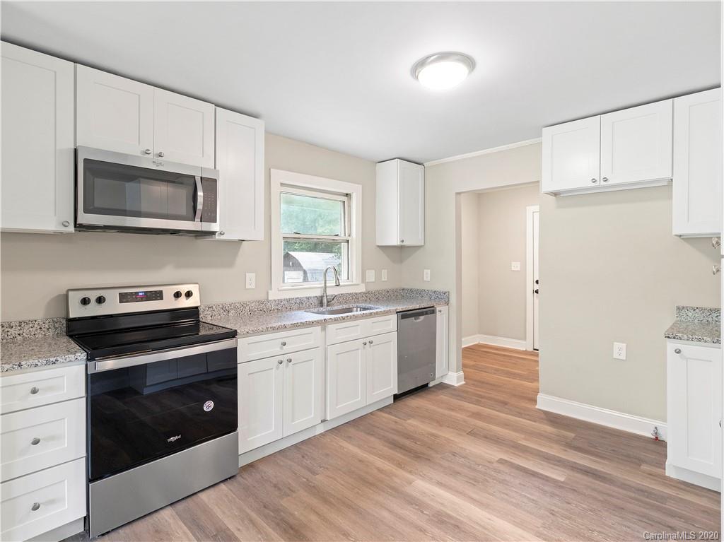 4152 Blenhein Road Charlotte, NC 28208 - Photo 12 of 34 a kitchen with a sink stove and microwave