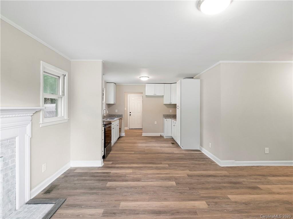 4152 Blenhein Road Charlotte, NC 28208 - Photo 14 of 34 a view of a kitchen with wooden floor and a refrigerator