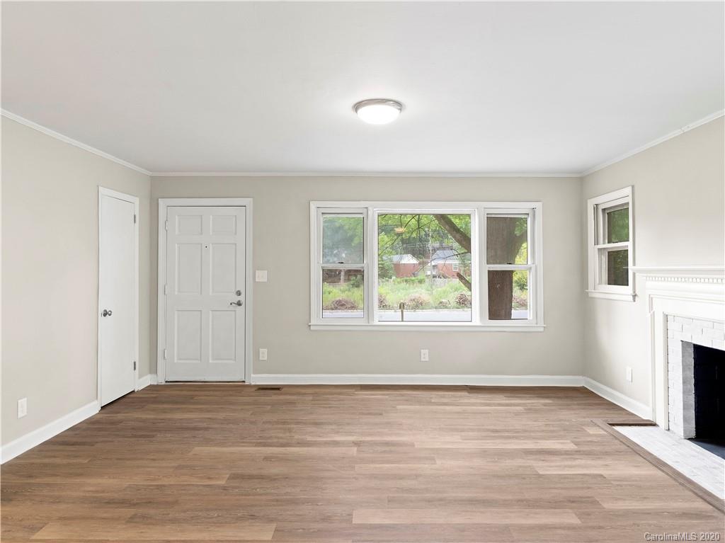 4152 Blenhein Road Charlotte, NC 28208 - Photo 15 of 34 an empty room with wooden floor and windows