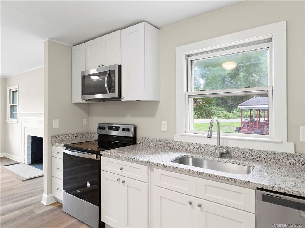 4152 Blenhein Road Charlotte, NC 28208 - Photo 16 of 34 a kitchen with appliances a sink and a window