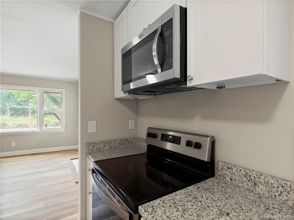 4152 Blenhein Road Charlotte, NC 28208 - Photo 18 of 34 a kitchen with a stove and a microwave