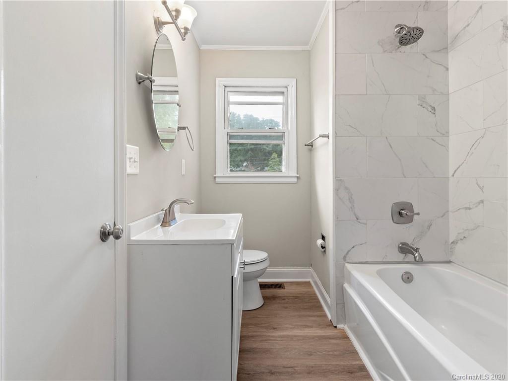 4152 Blenhein Road Charlotte, NC 28208 - Photo 26 of 34 a bathroom with a sink a toilet and shower