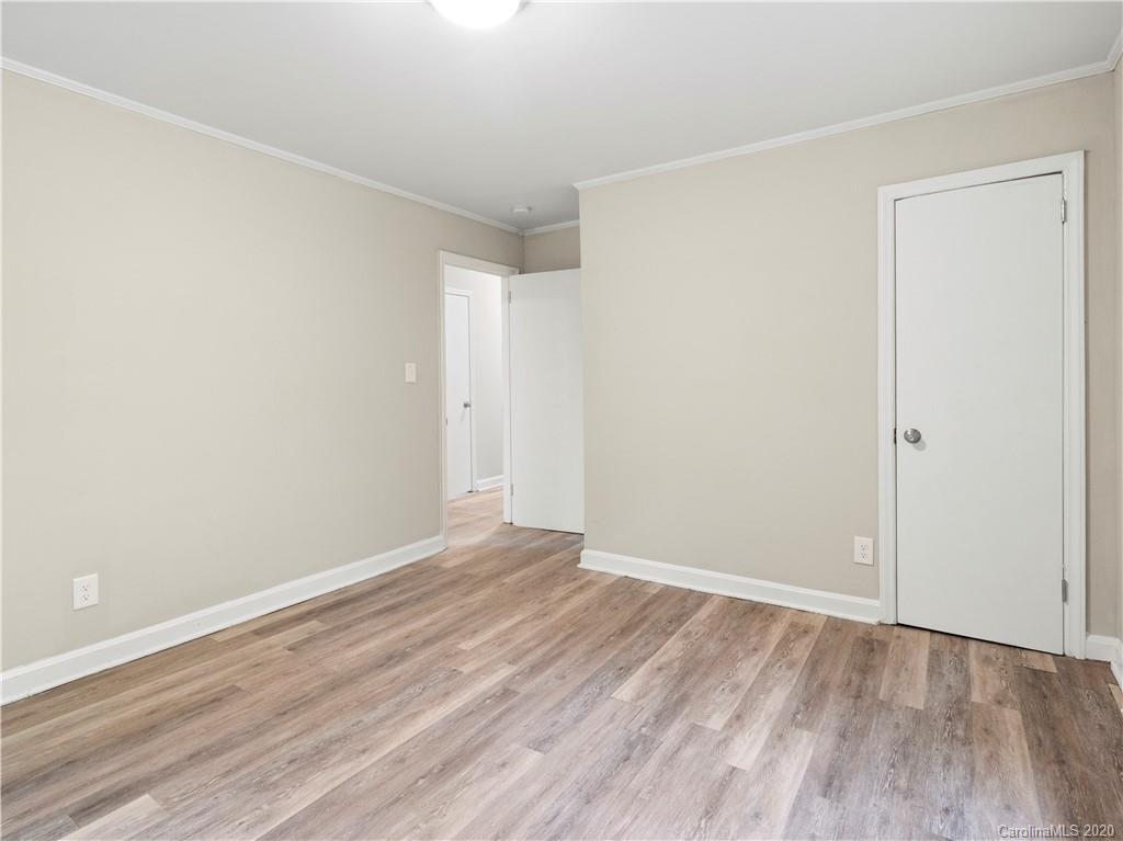 4152 Blenhein Road Charlotte, NC 28208 - Photo 29 of 34 a view of an empty room with wooden floor
