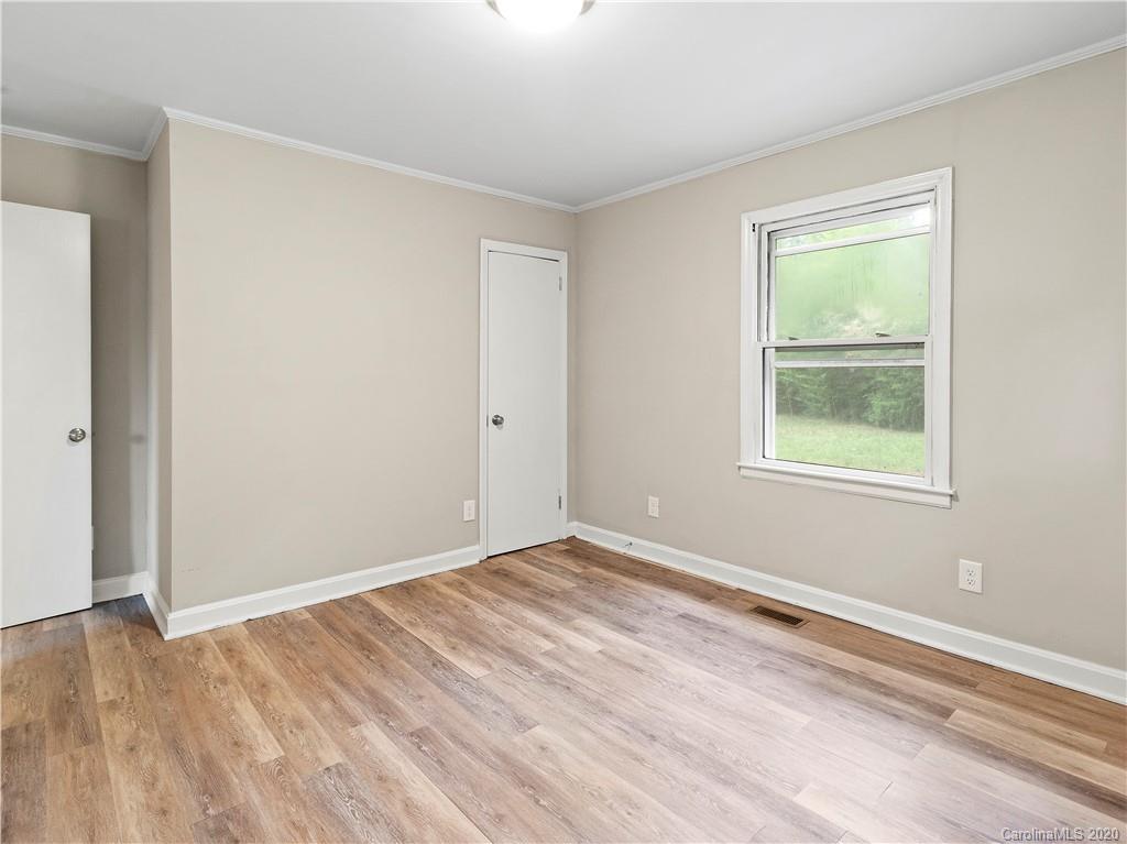 4152 Blenhein Road Charlotte, NC 28208 - Photo 30 of 34 a view of an empty room with wooden floor and a window