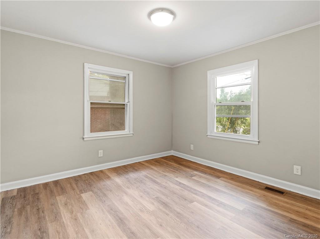 4152 Blenhein Road Charlotte, NC 28208 - Photo 31 of 34 a view of an empty room with wooden floor and a window