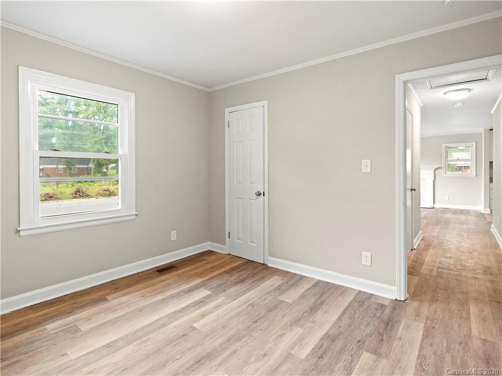 4152 Blenhein Road Charlotte, NC 28208 - Photo 32 of 34 wooden floor in an empty room with a window