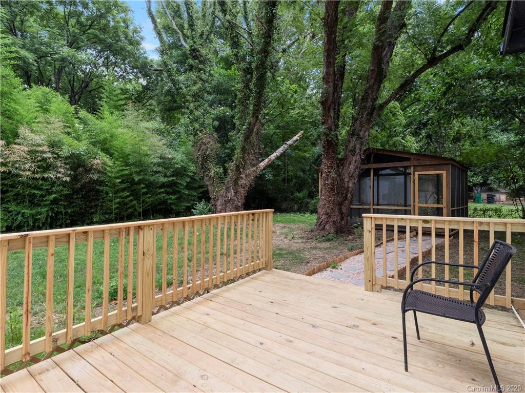 4152 Blenhein Road Charlotte, NC 28208 - Photo 8 of 34 a view of a wooden deck and a backyard