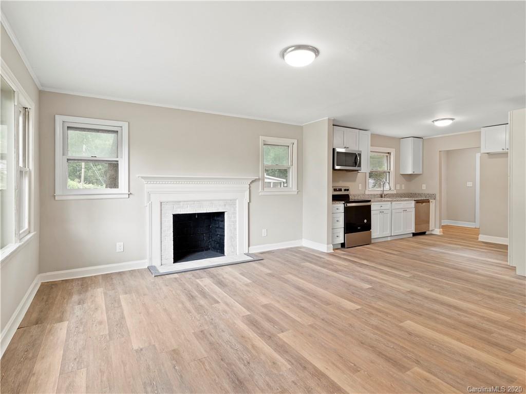 4152 Blenhein Road Charlotte, NC 28208 - Photo 9 of 34 a view of empty room with a fireplace and window