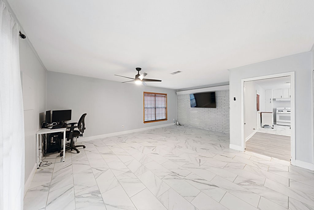 614 Gilpin Street Houston, TX 77034 - Photo 17 of 27 Discover the perfect entertaining space in this bonus room, seamlessly connected to the dining area.