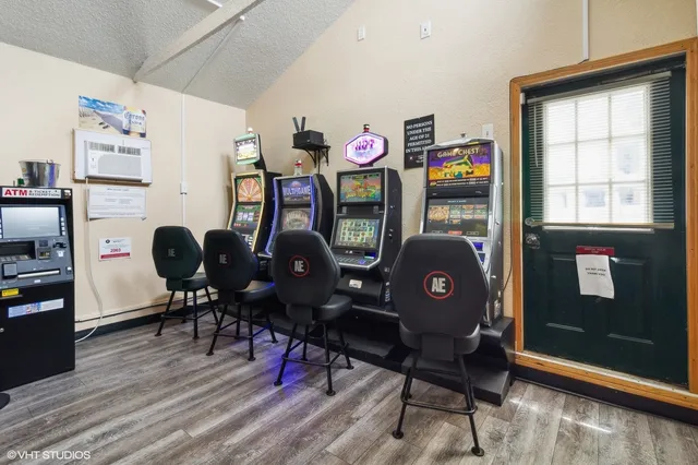 a view of a workspace with furniture and wooden floor