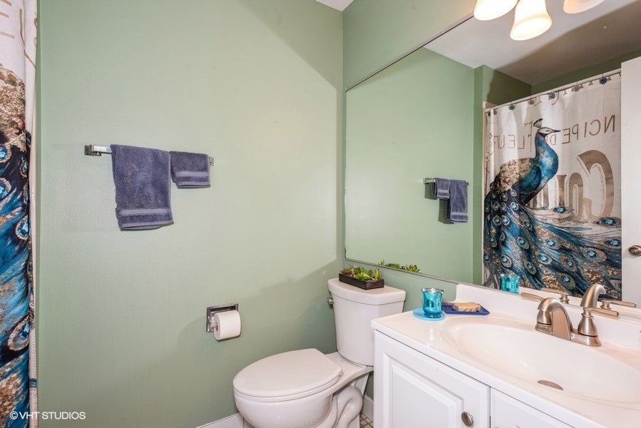 -n116 Windermere Road, Unit 2001 Winfield, IL 60190 - Photo 9 of 12 a bathroom with a granite countertop toilet sink and mirror