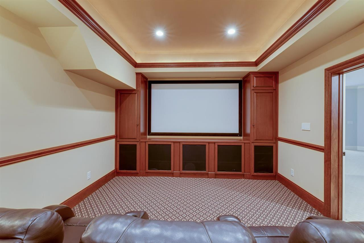 1317 Caistor Lane Raleigh, NC 27614 - Photo 8 of 24 The movie equipment all conveys - projector, screen, AV equipment, speakers - everything but the cable box! There's seating for 7 and they convey as well. Theater Room