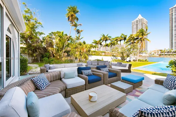 a view of swimming pool with outdoor seating and city view