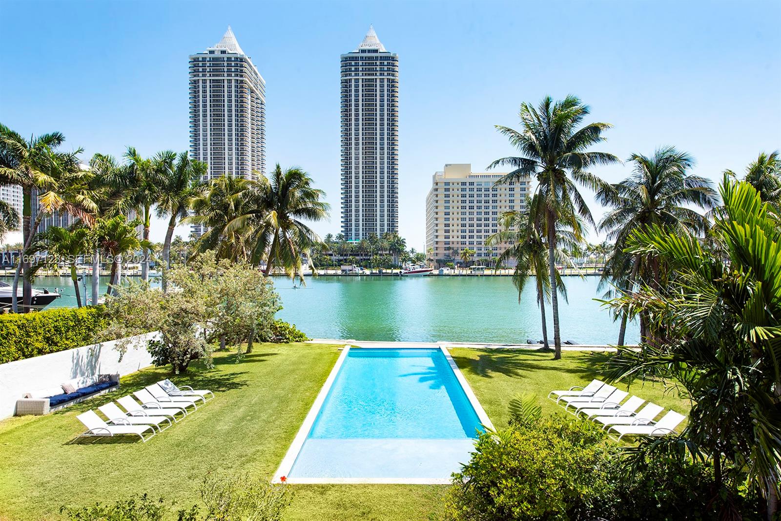 4745 Pine Tree Drive Miami Beach, FL 33140 - Photo 20 of 35 a view of a city with tall buildings and a big yard