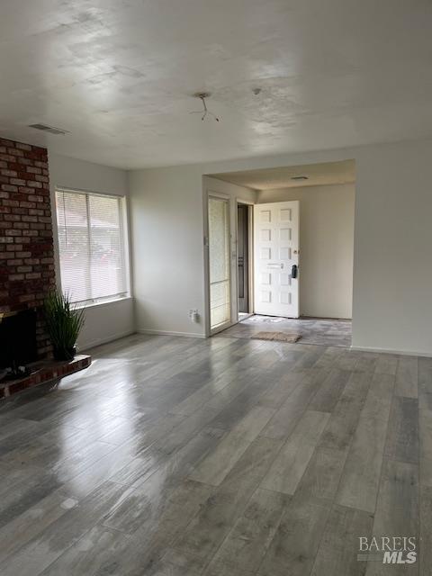 27 Woodgreen Street Santa Rosa, CA 95409 - Photo 5 of 11 an empty room with wooden floor and windows