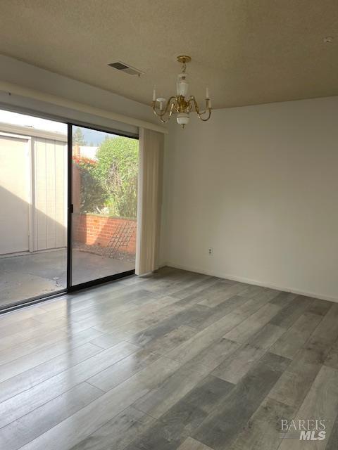 27 Woodgreen Street Santa Rosa, CA 95409 - Photo 8 of 11 wooden floor in an empty room with a window