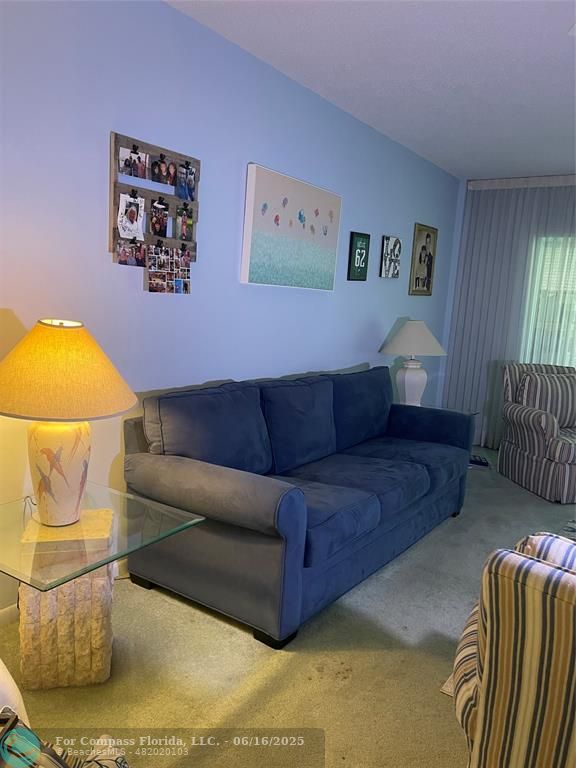 a living room with a couch and a table