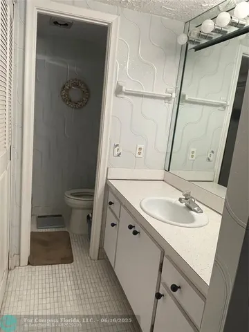 a bathroom with a sink and mirror