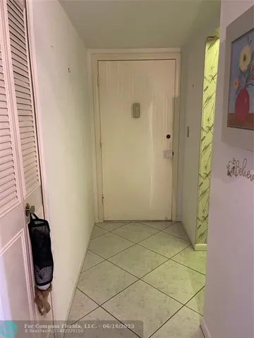 a bathroom with a granite countertop shower and a sink