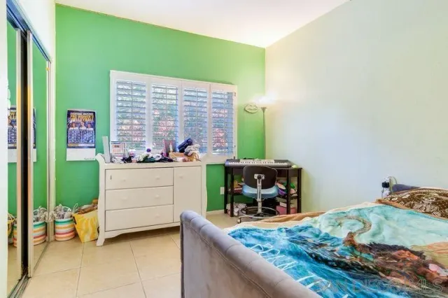 a room with a bed and furniture