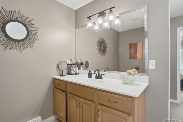 29 Hickory Hill Road Newburgh, NY 12550 - Photo 34 of 47 a bathroom with a sink vanity and a mirror