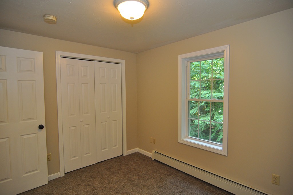 496 Loring Road Barre, MA 01005 - Photo 18 of 27 an empty room with windows