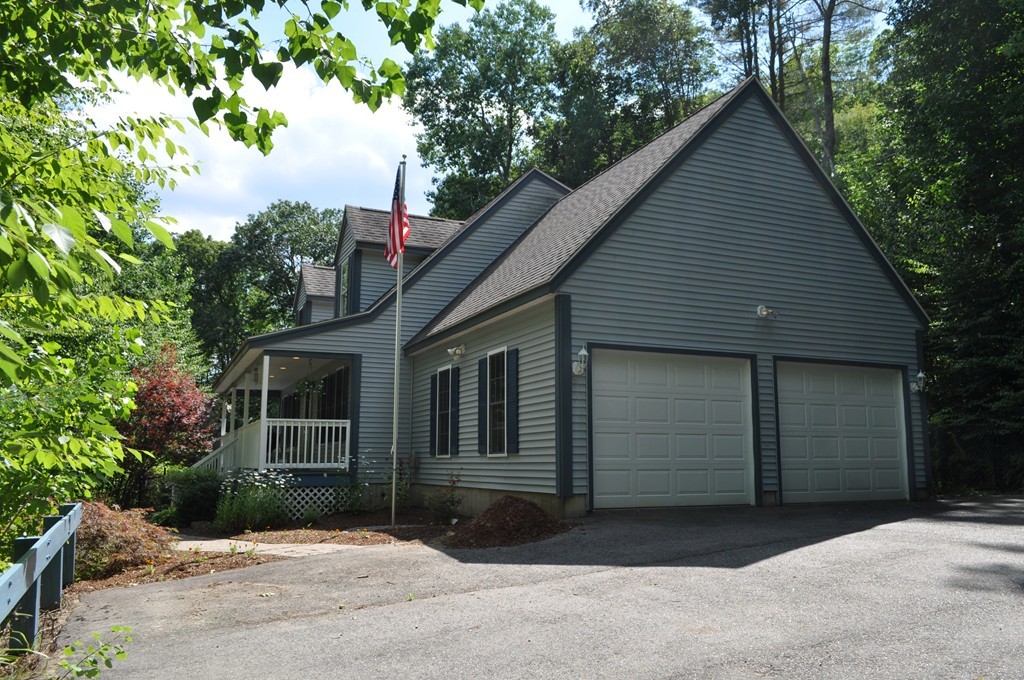 496 Loring Road Barre, MA 01005 - Photo 22 of 27 a front view of a house with a yard and garage