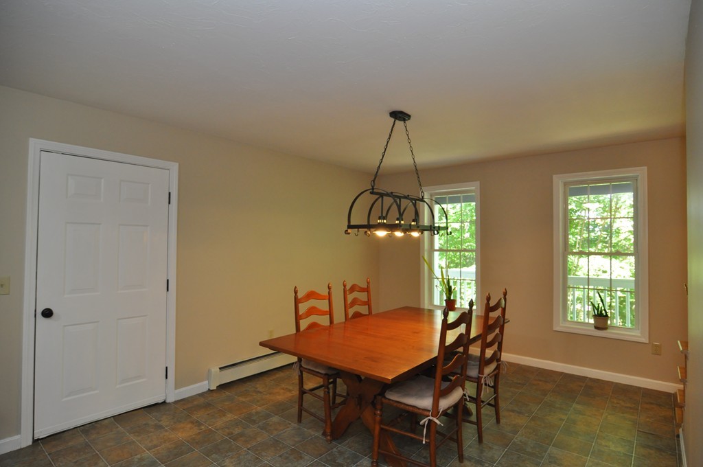 496 Loring Road Barre, MA 01005 - Photo 5 of 27 a view of a dining room with furniture window and wooden floor