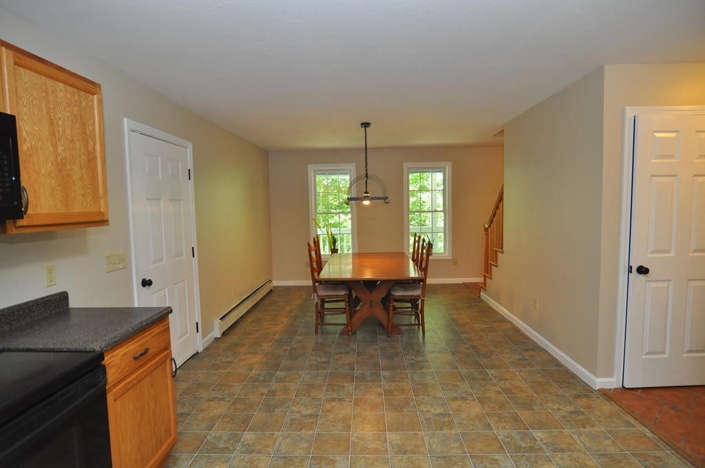496 Loring Road Barre, MA 01005 - Photo 6 of 27 a view of a dining room with furniture and chandelier
