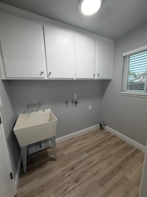 725 Sycamore Avenue Gustine, CA 95322 - Photo 13 of 31 a room with a sink cabinets and wooden floor