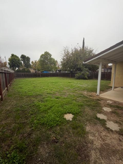 725 Sycamore Avenue Gustine, CA 95322 - Photo 17 of 31 a view of a house with a yard