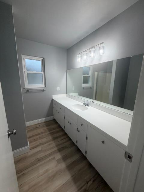 725 Sycamore Avenue Gustine, CA 95322 - Photo 25 of 31 a bathroom with a double vanity sink and mirror