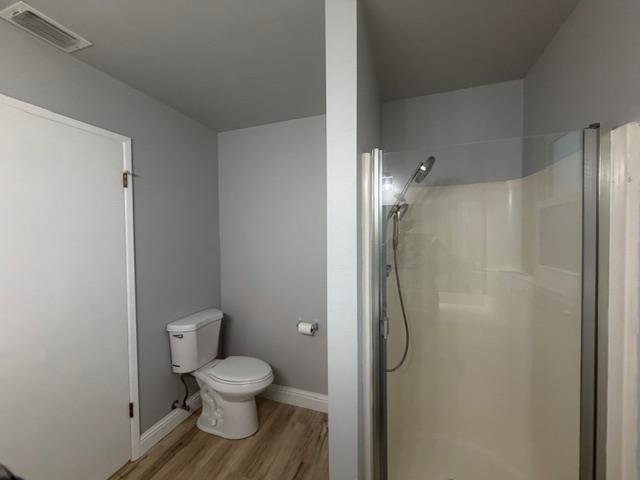 725 Sycamore Avenue Gustine, CA 95322 - Photo 27 of 31 a bathroom with a granite countertop toilet and a shower