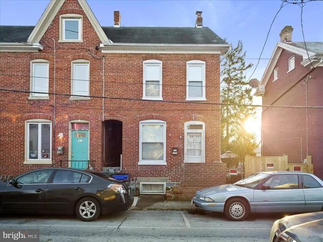 a car parked in front of a house