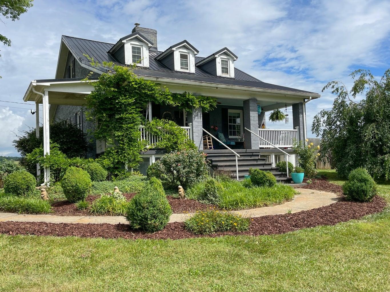 a front view of a house with a yard