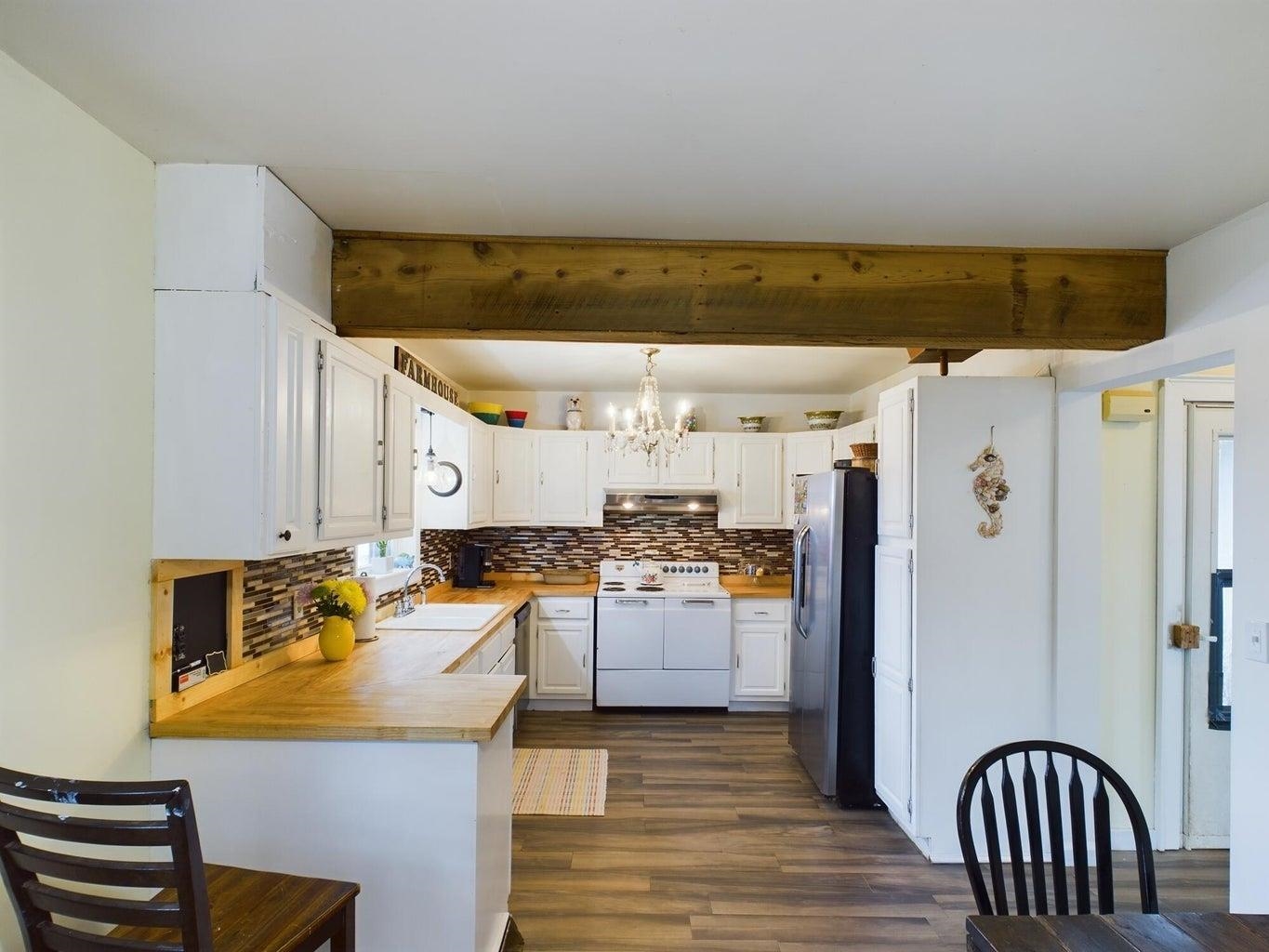 3416 Forge Road Glasgow, VA 24555 - Photo 15 of 51 a kitchen with stainless steel appliances granite countertop a refrigerator and a stove top oven