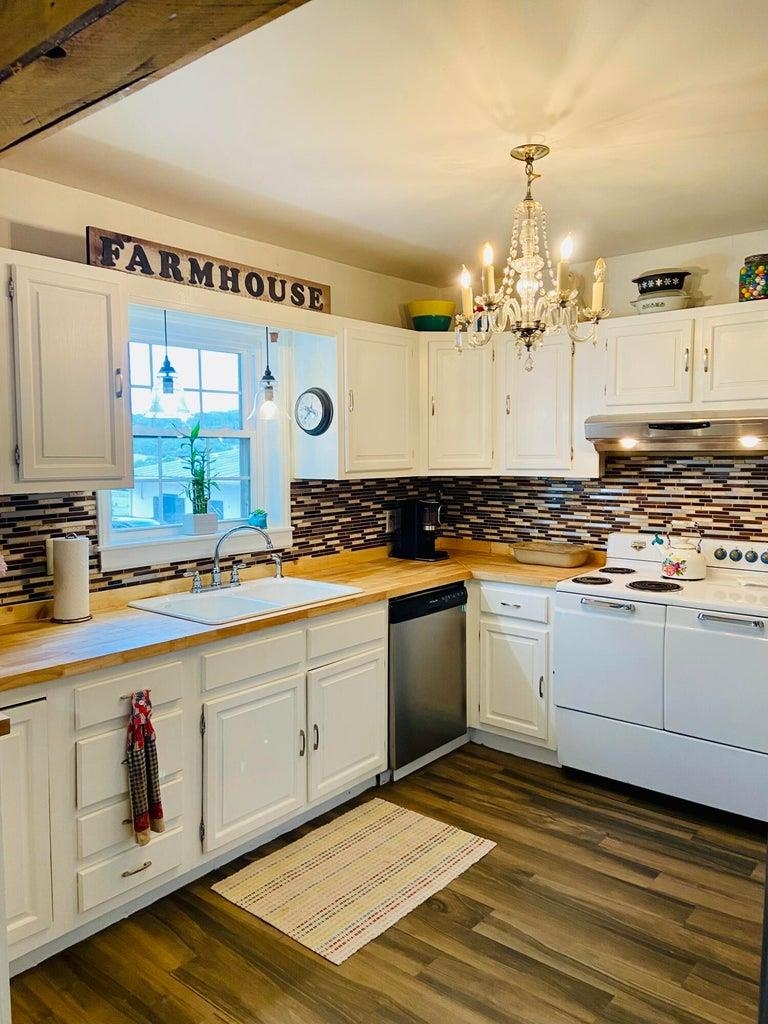 3416 Forge Road Glasgow, VA 24555 - Photo 16 of 51 a kitchen with stainless steel appliances granite countertop a sink and cabinets