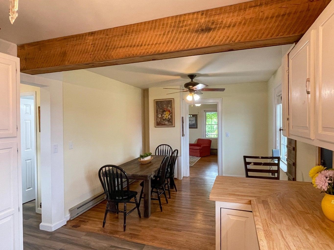 3416 Forge Road Glasgow, VA 24555 - Photo 18 of 51 a view of a dining room with furniture and wooden floor