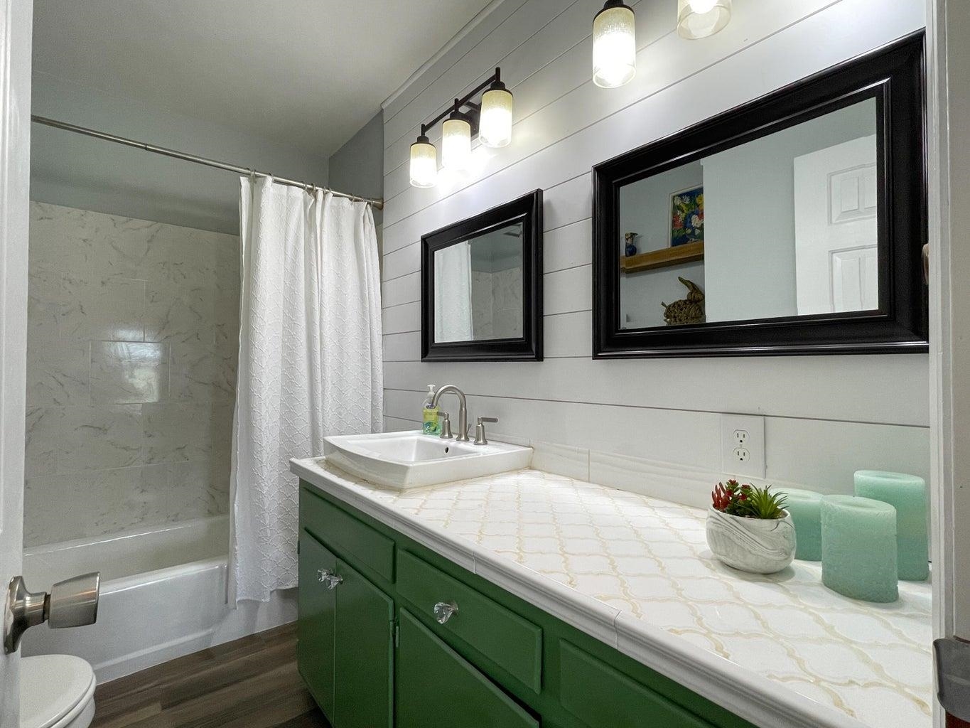 3416 Forge Road Glasgow, VA 24555 - Photo 19 of 51 a bathroom with a double vanity sink mirror and toilet