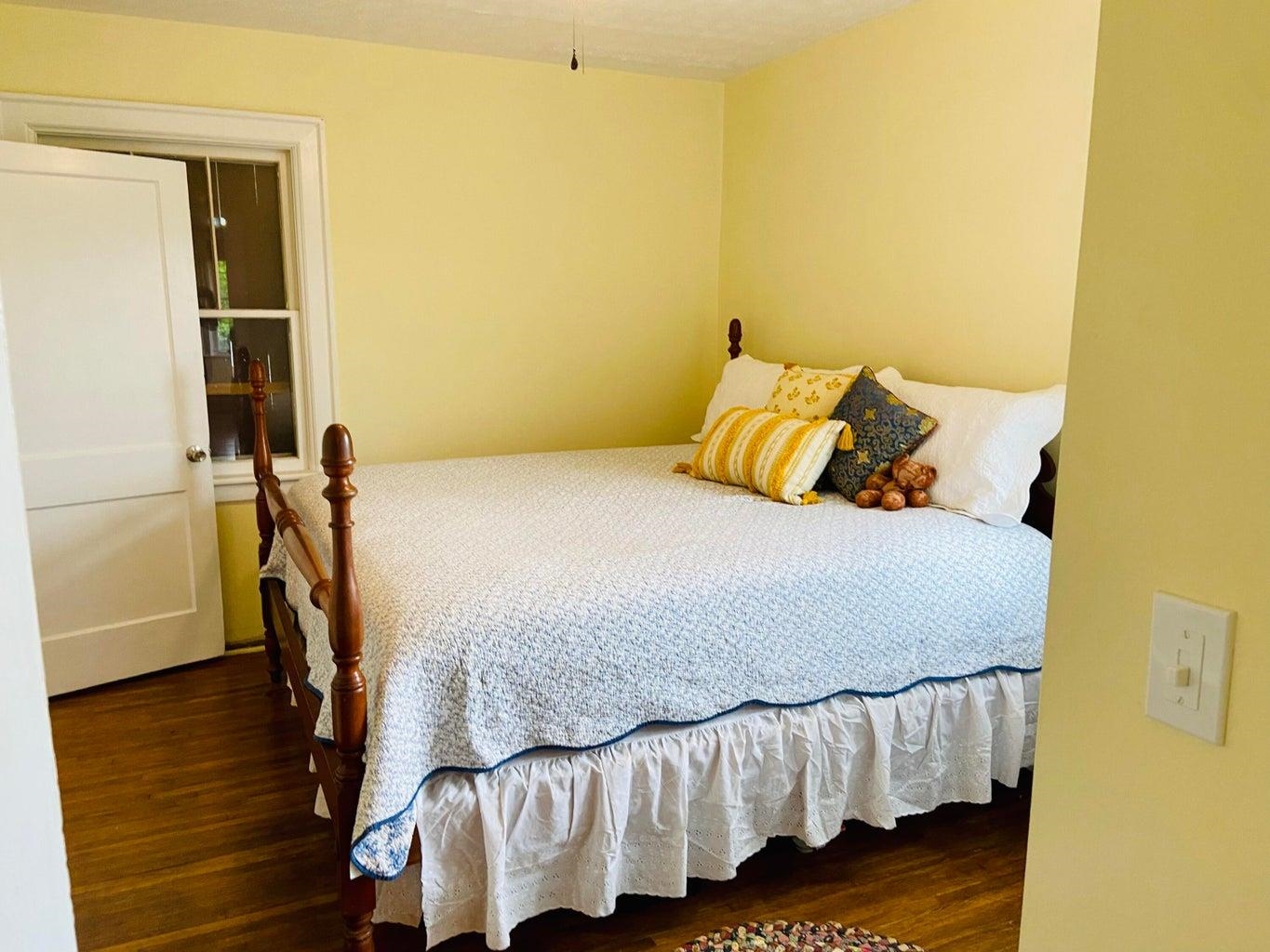 3416 Forge Road Glasgow, VA 24555 - Photo 20 of 51 a bedroom with a bed and wooden floor