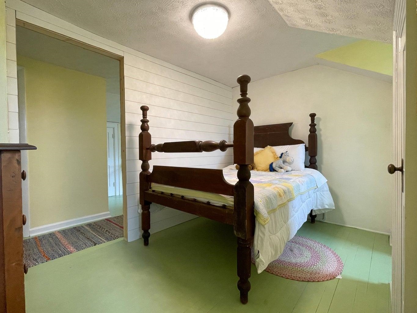 3416 Forge Road Glasgow, VA 24555 - Photo 21 of 51 a bed sitting in a bedroom next to a window