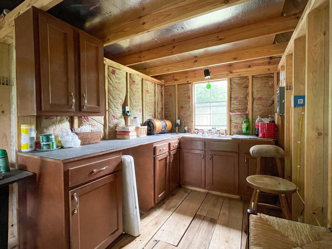 3416 Forge Road Glasgow, VA 24555 - Photo 28 of 51 a kitchen with sink cabinets and window