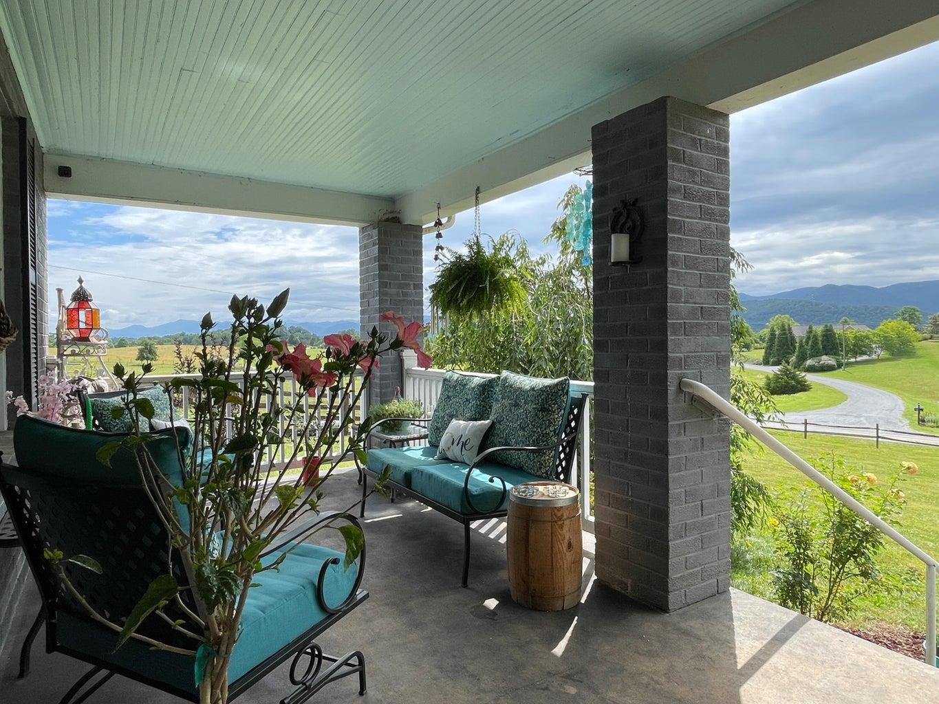 3416 Forge Road Glasgow, VA 24555 - Photo 7 of 51 a view of a porch with furniture and a potted plant