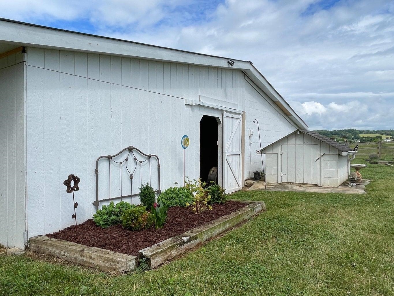 3416 Forge Road Glasgow, VA 24555 - Photo 8 of 51 a front view of a house with garden