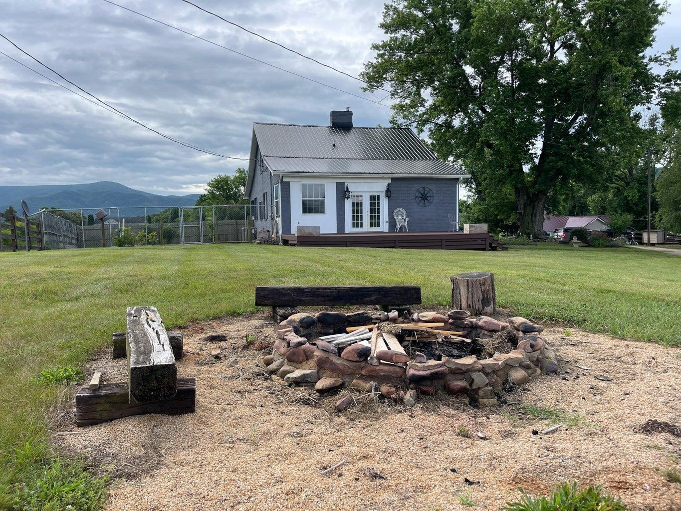 3416 Forge Road Glasgow, VA 24555 - Photo 10 of 51 a front view of a house with garden and patio