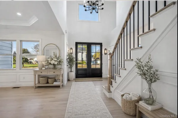 a view of hall way with furniture and staircase