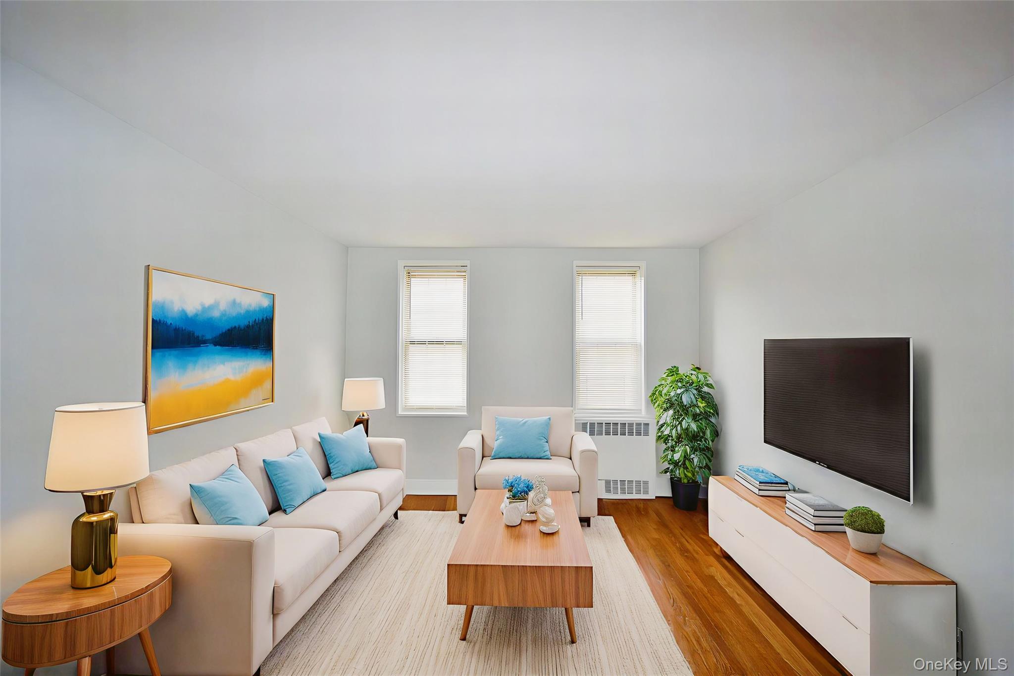 786 Bronx River Road, Unit B56 Bronxville, NY 10708 - Photo 3 of 8 a living room with furniture and a flat screen tv