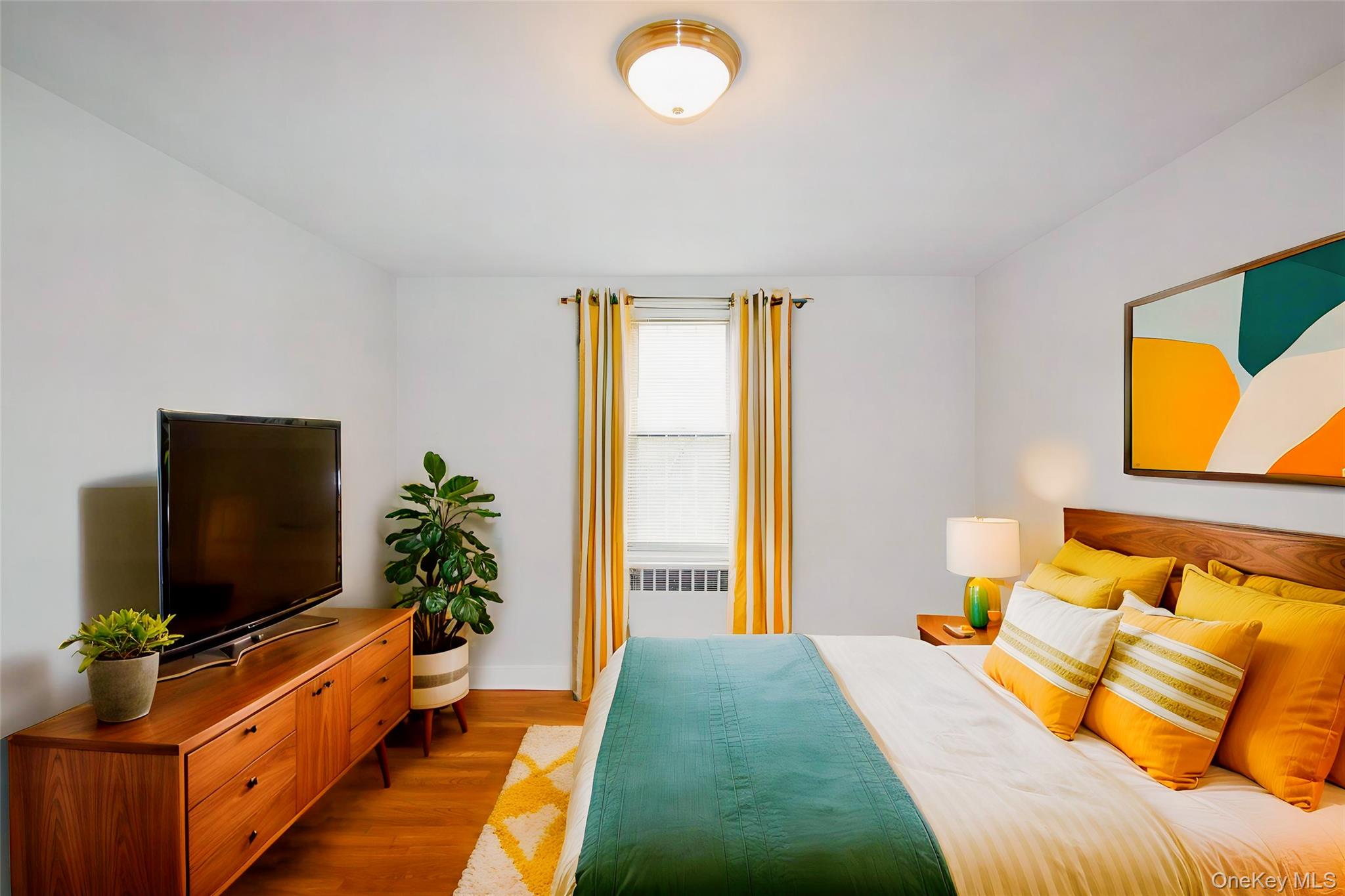 786 Bronx River Road, Unit B56 Bronxville, NY 10708 - Photo 7 of 8 a bedroom with a bed and a flat screen tv