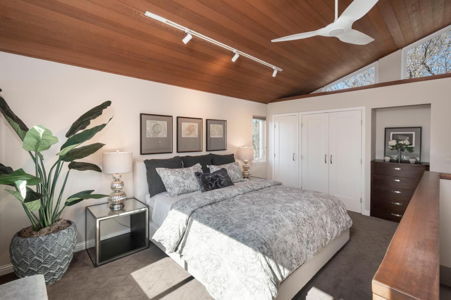 405 29th Avenue San Mateo, CA 94403 - Photo 14 of 22 a spacious bedroom with a large bed and a couch