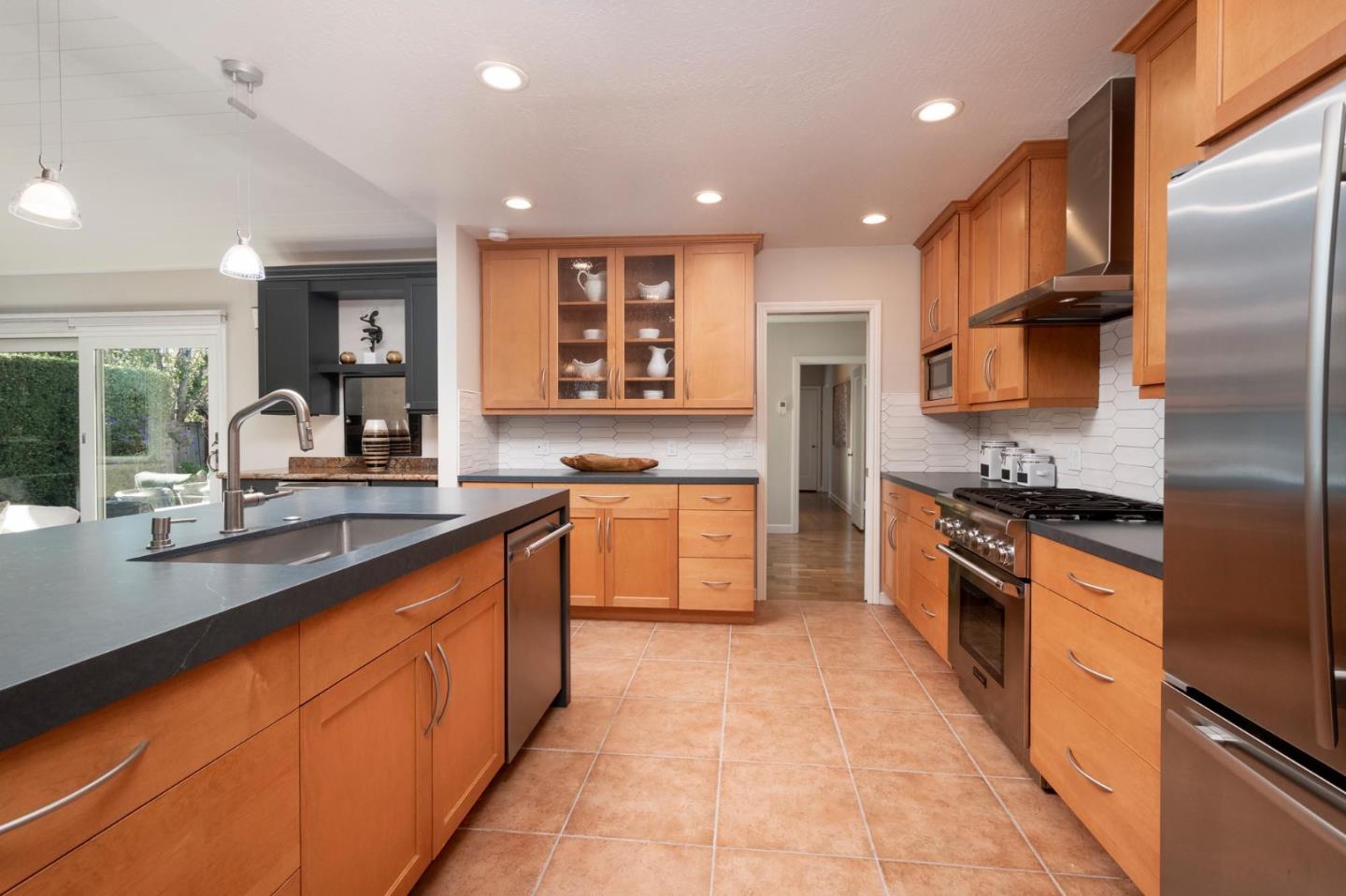 405 29th Avenue San Mateo, CA 94403 - Photo 10 of 22 a large kitchen with stainless steel appliances lots of counter space and a sink